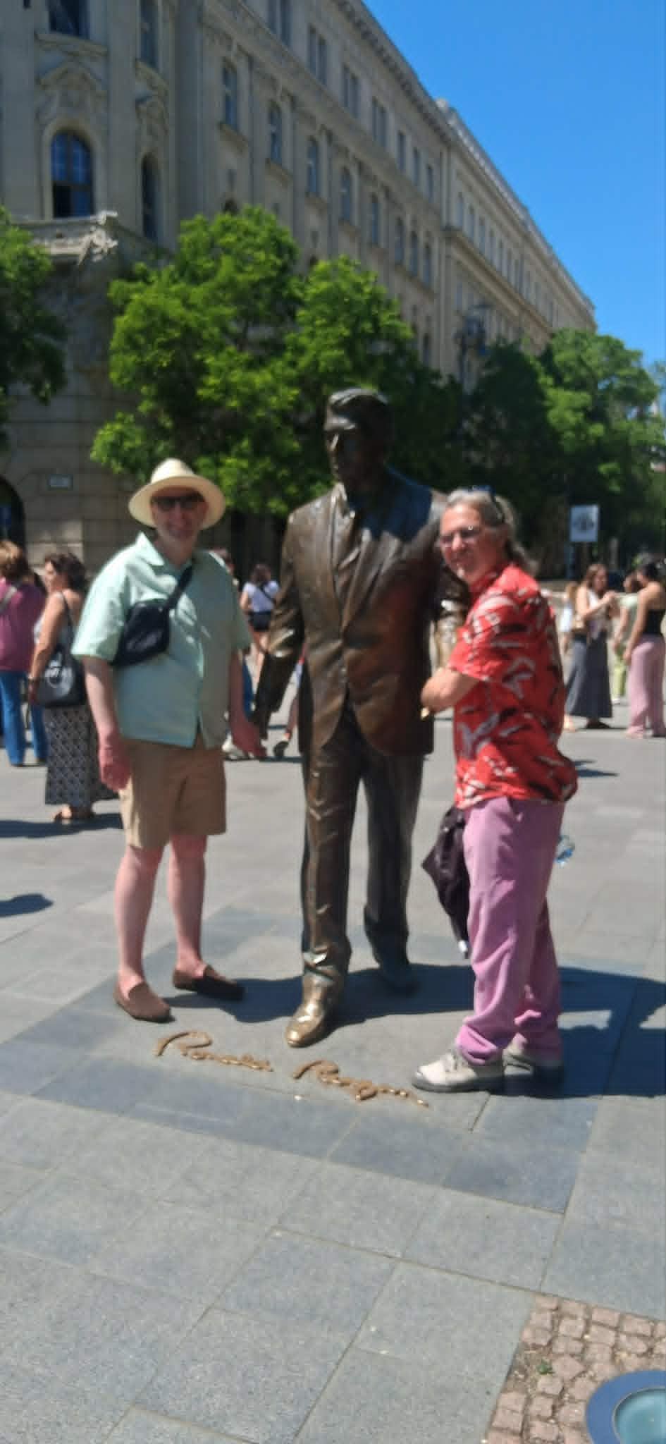 Tourists posing with the Ronald Reagan statue, Szabadság tér